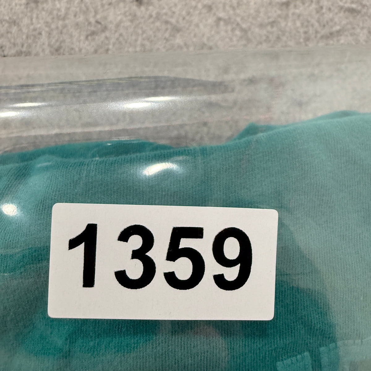 The North Face teal tee SKU tag 1359