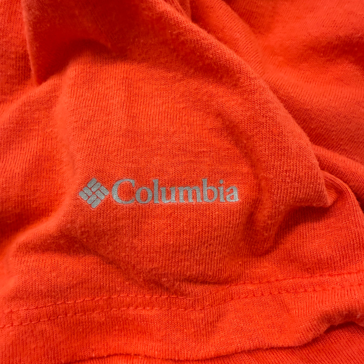 Columbia orange tee detail view