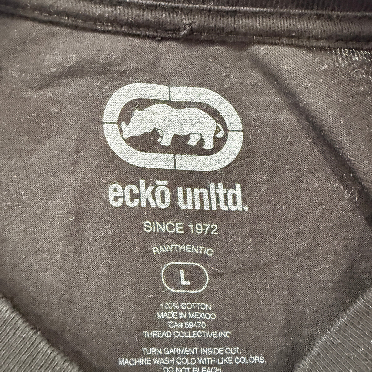 Ecko Unltd black tee brand and size tag