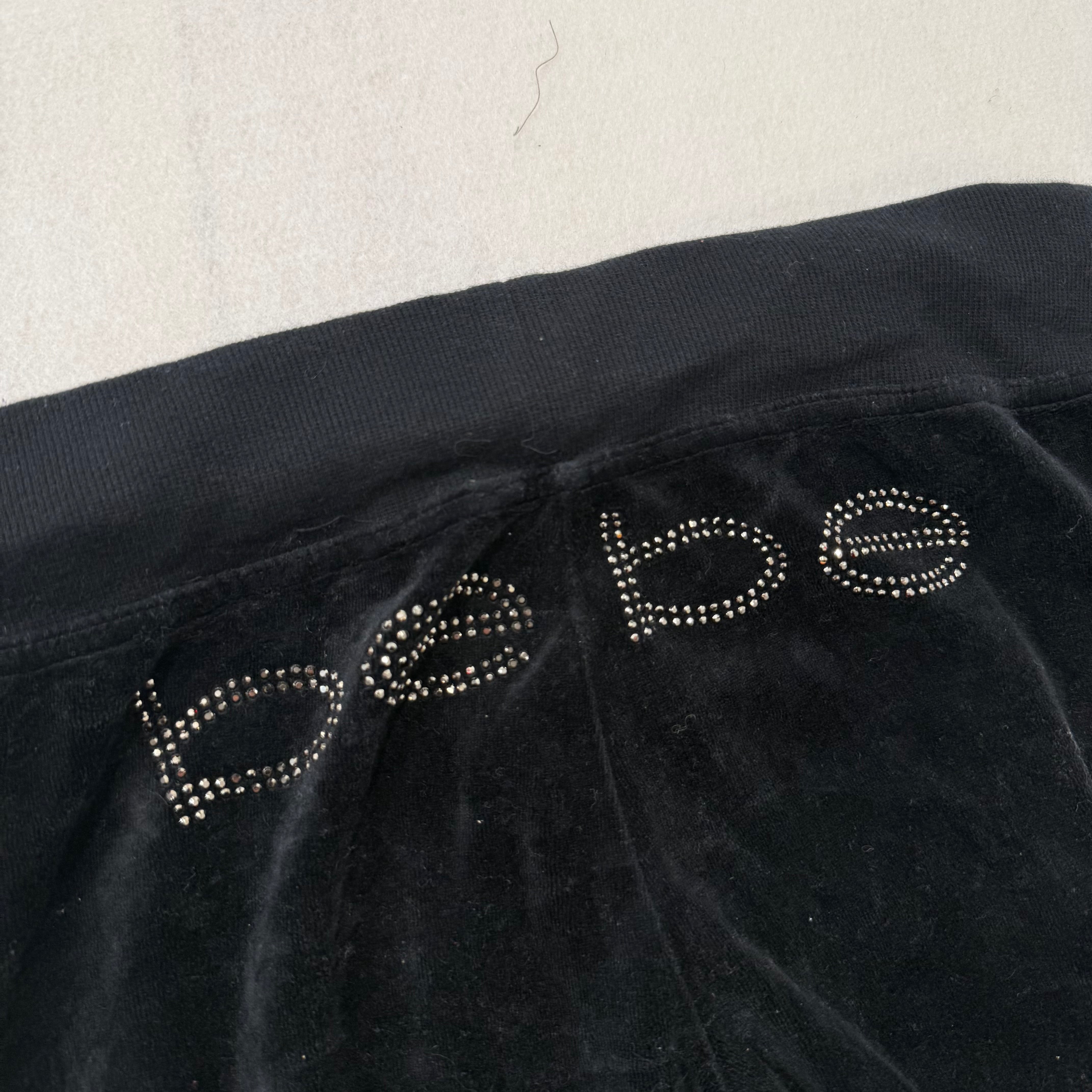 Bebe black velour rhinestone logo low rise flare pants size S