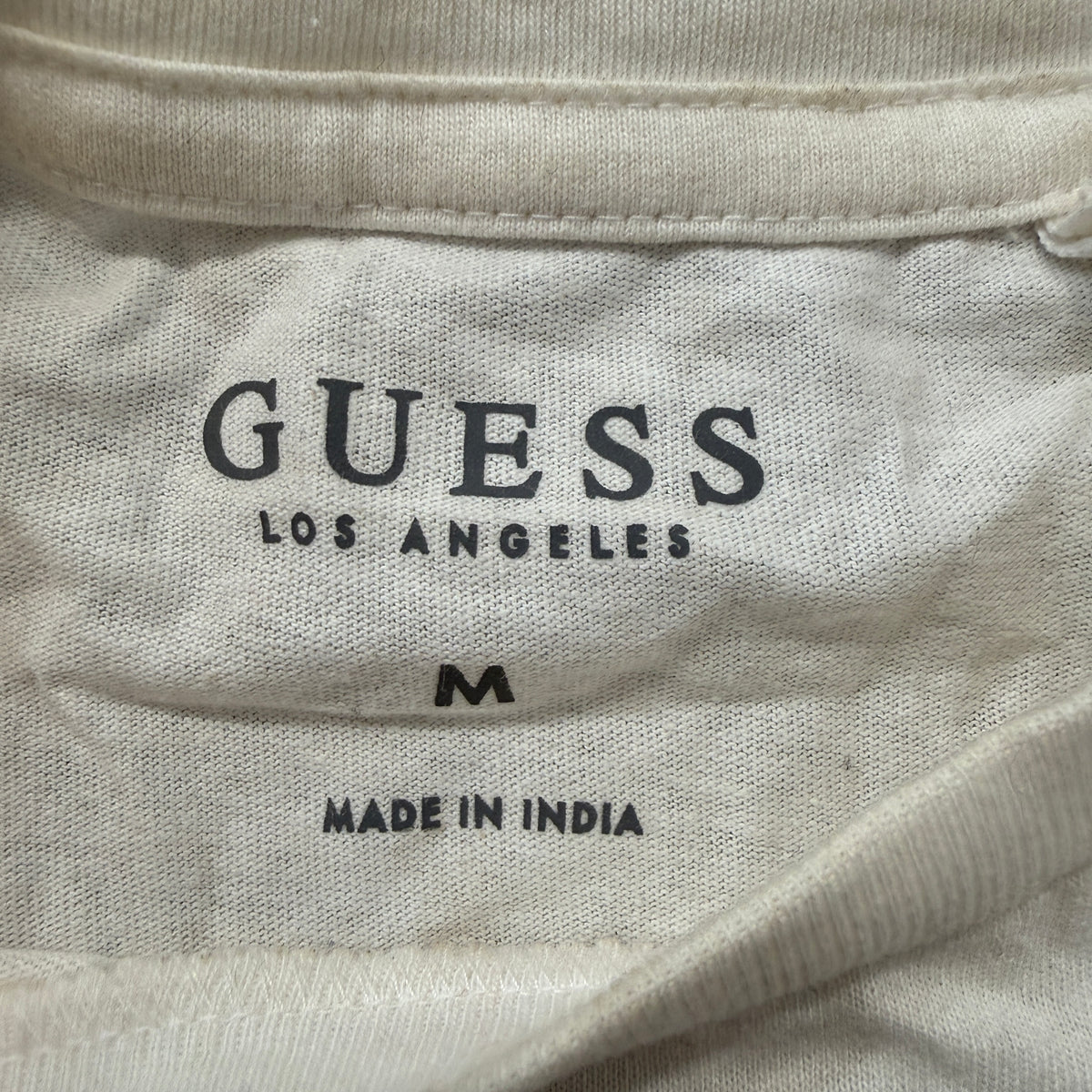 Guess LA cream tee brand and size tag