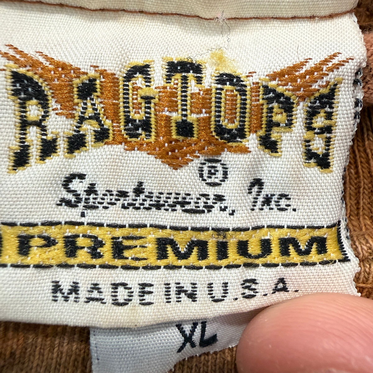 Ragtops brown tee brand and size tag