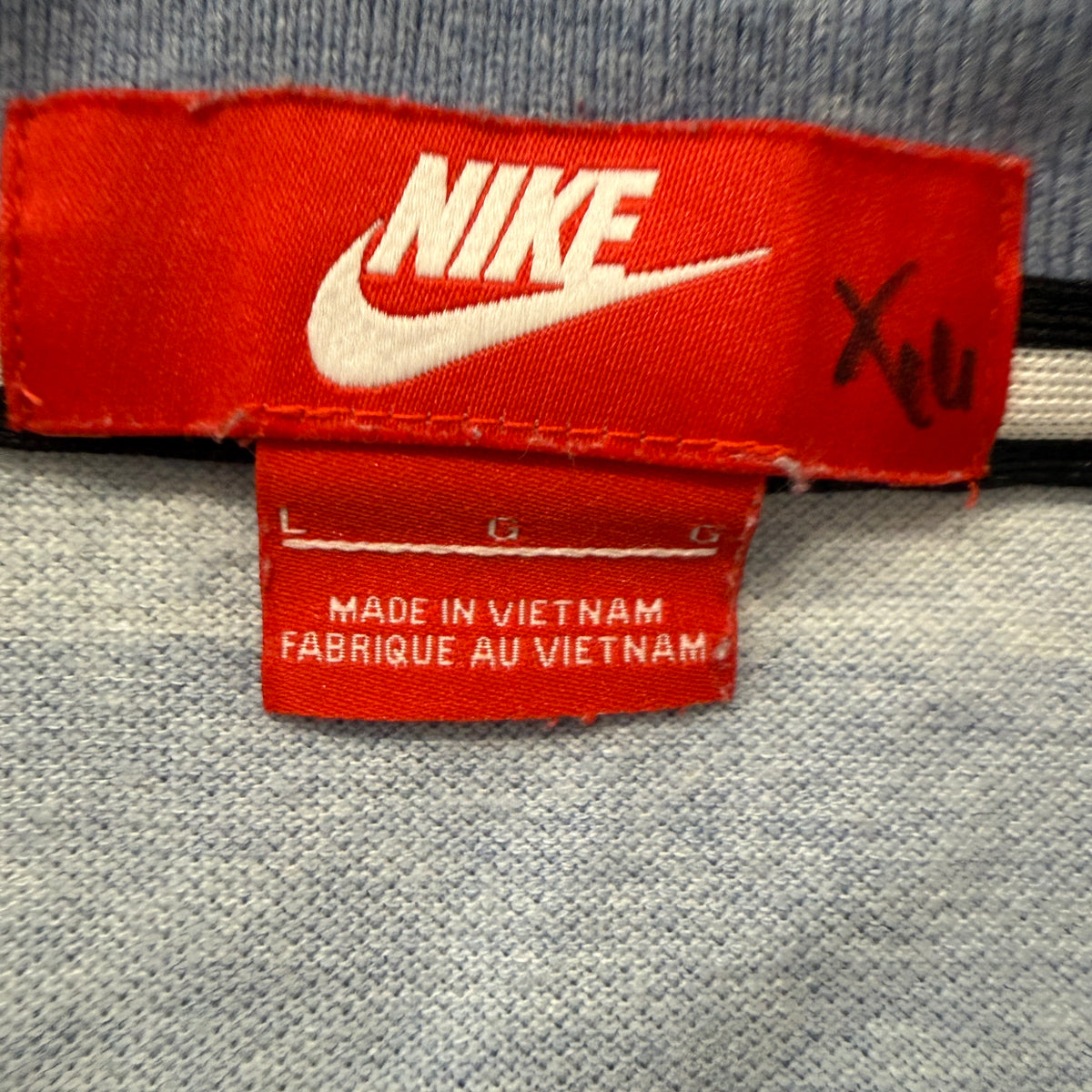 Nike polo brand size tag L
